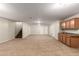 This large bonus room has carpeted floors, recessed lights, and a kitchenette, ideal for entertaining at 4255 S Marisol Ln, Gilbert, AZ 85297