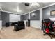 This home theater features a large screen, projector, mini-fridge, and comfortable seating at 4255 S Marisol Ln, Gilbert, AZ 85297