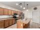 Efficient kitchen design featuring stainless steel appliances, functional island and wood cabinetry at 4255 S Marisol Ln, Gilbert, AZ 85297
