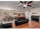 Open concept living room adjacent to kitchen and dining area perfect for entertaining at 4255 S Marisol Ln, Gilbert, AZ 85297