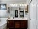 Bathroom featuring a double sink vanity with a large mirror and contemporary fixtures at 4606 S Marron --, Mesa, AZ 85212