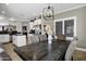 Open concept dining area featuring wood table, chair seating, and bright natural light from the kitchen at 4606 S Marron --, Mesa, AZ 85212