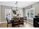 Elegant dining room with modern chandelier, and plantation shutters to let the sunshine in at 4606 S Marron --, Mesa, AZ 85212