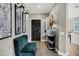 Bright foyer featuring tile floors, neutral paint, stylish decor, and a decorative entry door at 4606 S Marron --, Mesa, AZ 85212