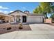 Inviting single-story home featuring a covered front porch, low maintenance landscaping, and a two-car garage at 4606 S Marron --, Mesa, AZ 85212