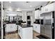 Bright kitchen features stainless steel appliances, granite countertops, white cabinets and an island at 4606 S Marron --, Mesa, AZ 85212