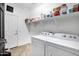 Functional laundry room with washer, dryer, shelving and utility sink, offering convenience at 4606 S Marron --, Mesa, AZ 85212