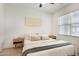 Sun-filled bedroom featuring neutral walls, wood floors, and light, airy bedding at 4657 S Vapor --, Mesa, AZ 85212