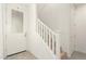 Bright entryway featuring natural wood stairs and a white door and trim at 4657 S Vapor --, Mesa, AZ 85212