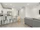 Stylish kitchen with sleek white cabinets, bar seating, and modern appliances at 4657 S Vapor --, Mesa, AZ 85212