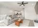 Cozy living room showcasing open floor plan with kitchen and lots of natural light at 4657 S Vapor --, Mesa, AZ 85212