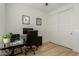 Home office with glass desk, sliding closet, and wood-look flooring at 4657 S Vapor --, Mesa, AZ 85212