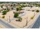 Charming single-story ranch home with a long driveway and desert landscaping in a rural setting at 51089 W Julie Ln, Maricopa, AZ 85139