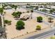 Charming single-story ranch home with gravel driveway and desert landscaping in a rural setting at 51089 W Julie Ln, Maricopa, AZ 85139