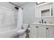 This bathroom showcases a shower-tub combo, toilet, vanity, sink and medicine cabinet at 51089 W Julie Ln, Maricopa, AZ 85139