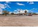 Welcoming ranch home offering a large lot with mature trees and easy access parking at 51089 W Julie Ln, Maricopa, AZ 85139