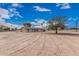 Spacious single-story home with a large front yard, mature trees, and ample parking at 51089 W Julie Ln, Maricopa, AZ 85139