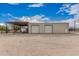 Spacious garage with two large bay doors, sheltered area, and adjacent door at 51089 W Julie Ln, Maricopa, AZ 85139