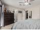 Well-lit carpeted main bedroom features an exit to a main bathroom and another door to the closet at 51089 W Julie Ln, Maricopa, AZ 85139