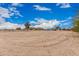 Vast property with clear, expansive land and distant mountain views on a sunny day at 51089 W Julie Ln, Maricopa, AZ 85139
