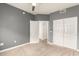 Neutral bedroom with carpet, ceiling fan, closet, and white doors at 5450 E Deer Valley Dr # 3023, Phoenix, AZ 85054