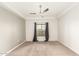 Cozy bedroom features plush carpeting, neutral walls, and a window with curtains, creating a relaxing atmosphere at 5450 E Deer Valley Dr # 3023, Phoenix, AZ 85054