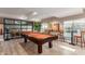 Billiards room with pool table, bar stools, stylish decor, and bright natural light near the pool at 5450 E Deer Valley Dr # 3023, Phoenix, AZ 85054