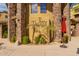 Terracina Apartment Homes building entrance with stone accents and manicured landscaping at 5450 E Deer Valley Dr # 3023, Phoenix, AZ 85054