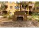 Outdoor fireplace with stone surround creates a cozy ambiance in this beautiful common outdoor area at 5450 E Deer Valley Dr # 3023, Phoenix, AZ 85054