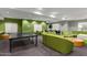 Inviting game room featuring a ping pong table, foosball, and comfortable green sofa seating at 5450 E Deer Valley Dr # 3023, Phoenix, AZ 85054