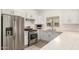 Updated kitchen featuring stainless steel appliances, stone countertops, and modern gas range at 5450 E Deer Valley Dr # 3023, Phoenix, AZ 85054