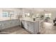 Bright kitchen featuring modern appliances, light wood floors, and stone countertops at 5450 E Deer Valley Dr # 3023, Phoenix, AZ 85054