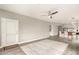 Open concept living room featuring a view of the kitchen, ceiling fan, and vinyl plank flooring at 5450 E Deer Valley Dr # 3023, Phoenix, AZ 85054