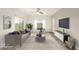 Inviting living room with lots of natural light, ceiling fan and comfortable seating arrangement at 5450 E Deer Valley Dr # 3023, Phoenix, AZ 85054