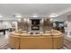 Relaxing lounge features a stone fireplace and large, tan, semi-circular sofa at 5450 E Deer Valley Dr # 3023, Phoenix, AZ 85054