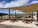 Covered picnic area featuring multiple tables, perfect for community gatherings and outdoor dining at 5510 W Buist Ave, Laveen, AZ 85339