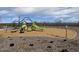 Playground with a variety of climbing structures, slide, and swings, ensuring hours of fun and recreation at 5510 W Buist Ave, Laveen, AZ 85339