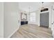 Inviting entryway with dining area, brick accent wall, and beverage center; adjacent to front door entrance at 6041 E Hartford Ave, Scottsdale, AZ 85254