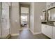 Modern bathroom featuring a marble shower, neutral walls, and tile flooring for a spa-like experience at 6091 N Sunrise Ln, Buckeye, AZ 85396