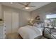 Bedroom with a cozy bed, soft lighting, neutral tones, and stylish furniture at 6091 N Sunrise Ln, Buckeye, AZ 85396