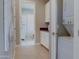 Functional laundry area with white cabinets, countertops, and modern appliances for added convenience at 6091 N Sunrise Ln, Buckeye, AZ 85396