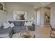 Comfortable living room featuring a gray sectional sofa, decorative pillows, and stylish decor at 6091 N Sunrise Ln, Buckeye, AZ 85396