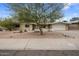 Inviting single-level home with a low-maintenance desert landscaped front yard and an attached garage at 6912 N 19Th St, Phoenix, AZ 85016