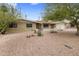 Charming single-story home with a well-maintained desert landscaped front yard and attached garage at 6912 N 19Th St, Phoenix, AZ 85016