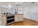 Modern kitchen island with granite countertops, stainless steel appliances, and seamless transition to the living space at 6912 N 19Th St, Phoenix, AZ 85016