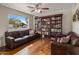 Cozy living room with hardwood floors, built-in bookshelves, comfortable seating, and natural light at 6912 N 19Th St, Phoenix, AZ 85016
