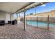 Covered patio with brick flooring and outdoor furniture, overlooking the fenced pool area at 6912 N 19Th St, Phoenix, AZ 85016