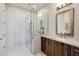 Bathroom featuring a glass shower, tile floor, granite countertop, and wood vanity at 7275 N Scottsdale Rd # 1001, Paradise Valley, AZ 85253