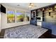 Bedroom featuring a ceiling fan, dark hardwood floors, built-in shelves and three large windows at 7275 N Scottsdale Rd # 1001, Paradise Valley, AZ 85253