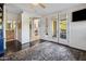 Spacious room featuring hardwood floors, balcony access, closet and bathroom access at 7275 N Scottsdale Rd # 1001, Paradise Valley, AZ 85253
